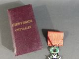 a medal and a book sitting on a table