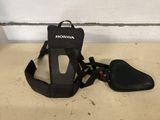 a close up of a motorcycle seat and harness on a floor