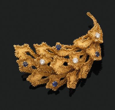 an image of a gold and diamond broochle