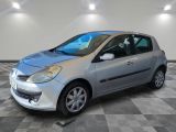 a picture of a small silver car parked in a garage