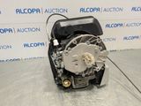 a close up of a motor on a table in front of a wall