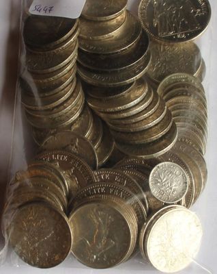 a lot of coins in a plastic bag on the table