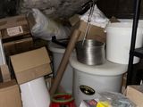 a pile of boxes and other items in a room