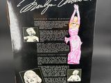 the back cover of a barbie doll with a picture of marilyn monroe