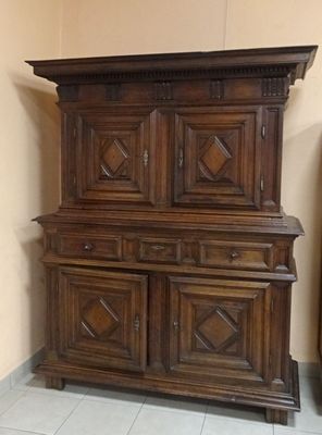a large wooden cabinet in the corner of a room