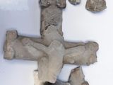 a cross made out of rocks and a bunch of other items