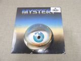 a close up of a magazine with a blue eye on it