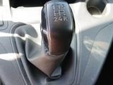 an image of a car ' s gear lever in the center console