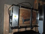 a metal box that is on top of a wooden pallet
