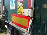an image of a garbage truck with stickers on it