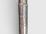 a metal pipe that has a hole in the middle of it