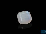 a square white oplite stone with a black background