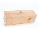 a wooden box with a label on it sitting on a white surface