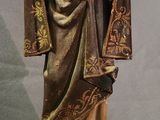a statue of a woman holding a child on a pedestal