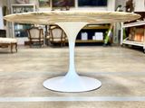 a white table with a wooden top in a room