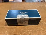 a close up of a box of cigarettes on a wooden table