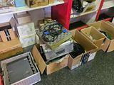 many boxes of electronic equipment on the shelves in the room