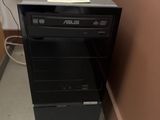 a black computer tower with a paper on top of it