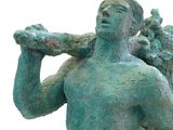 statue of a man with a bird on his shoulder and a bird on his shoulder