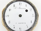 an image of a close up of a pocket watch on a white surface