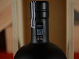 a bottle of wine that is sitting on a table