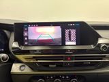 the interior of a car with a digital display on the dashboard