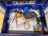 a blue box with tools in it on the floor