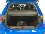 the back of a blue car with its trunk open and a speaker in the trunk