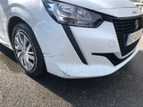 a white car parked on the side of the road