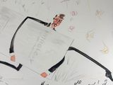 a drawing of a man in a suit holding a piece of paper