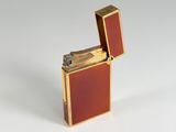 a lighter that is sitting on a white surface