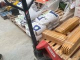 a pallet full of wood sitting on a pallet in a warehouse