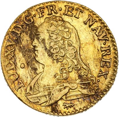 gros plan d'une pièce d'or avec un visage de femme