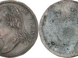 a close up of a coin on a white background