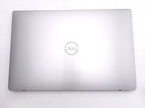 a dell laptop sitting on a table with a white background