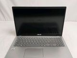 an open laptop computer sitting on top of a white surface