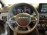 the interior of a car with a steering wheel and dashboard controls