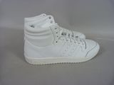 white adidas sneakers on a white surface with a white background
