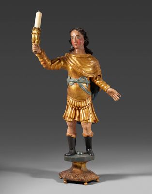 une image représentant la statue d'un homme tenant une bougie allumée