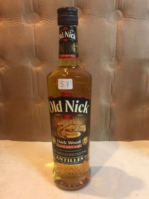 an image of a bottle of old nick whiskey sitting on a table