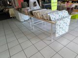 a table with a lot of books on it in a store