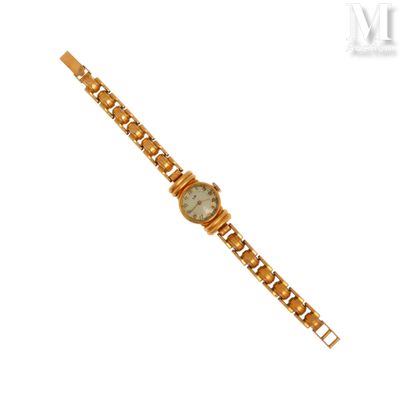 une image d'une montre-bracelet en or avec un cadran blanc