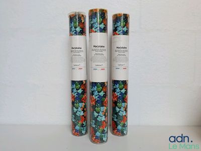 three rolls of wrapping paper sitting on top of a table