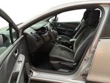 the interior of a car with the door open and the driver ' s seat down