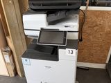 a white printer sitting on top of a black and white printer