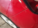 a close up of a red car ' s tail light
