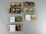 several old photos of people are displayed on a table
