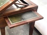 a small table with a drawer on top of it