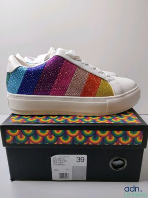 a pair of colorful shoes sitting on top of a box