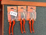 four pliers are sitting on a table with a price tag on them
